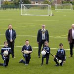 Lord Mayor, Councillor Kevin Savage (centre) is joined by (L-R) Roisin Woods, Principle, St Patrick's College. Councillor Paul Greenfield, Chairperson of the Local PEACE IV Partnership, George Lucas, Sport NI, Tony Kearney, Head of Sport, St Patrick’s College and pupils Chloe, Fionn, Mya and Marc on site at the Community Sports Campus at St Patrick's College.