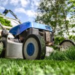 An image of a lawn mower on the grass