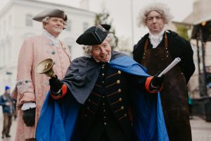 Three people dressed up in victorian clothes for the Georgian Day.