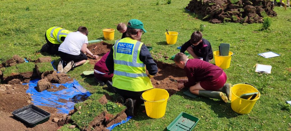 School children digging.