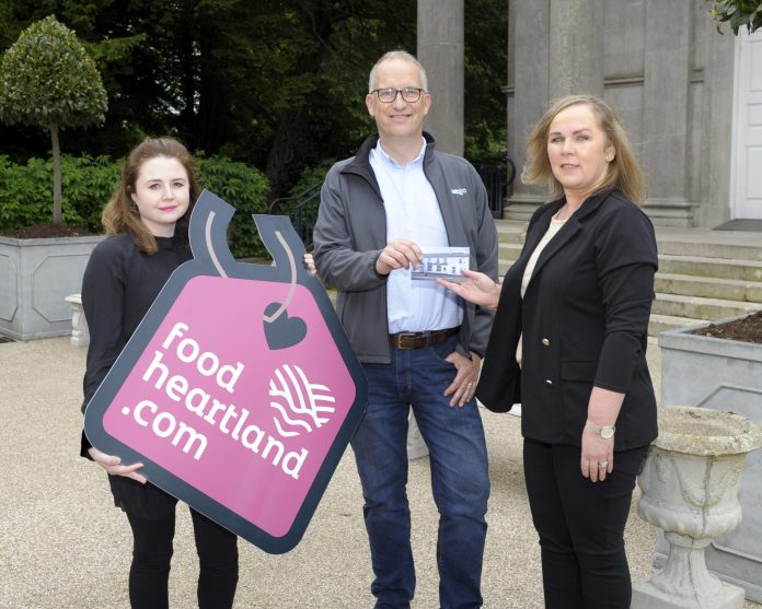Local businessman Alistair Cairns receives his £100 voucher for The Halfway House restaurant from Elaine Cullen, Interim Enterprise Development Manager and Sarah McKnight, Food Heartland Assistant as part of the Food Heartland Network sign-up draw