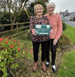 Elsie Parks and Hazel Guiney proudly display their award.