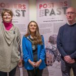 The Lord Mayor Councillor Sarah Duffy is pictured with a female and male in front of pop up banners saying Posters from the Past'. They are pictured together to promote the Posters from the Past Exhibition at Armagh County Museum.