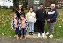 Lord Mayor of ABC Borough, Cllr Sarah Duffy with her daughters Emily and Lucia at the duck feeder in Lurgan Park, with Leanne McShane, Outdoor Spaces Development Officer ABC Council and visitors to the park.