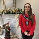 Female standing with festive background