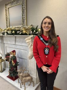 Female standing with festive background