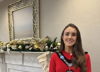 Female standing with festive background