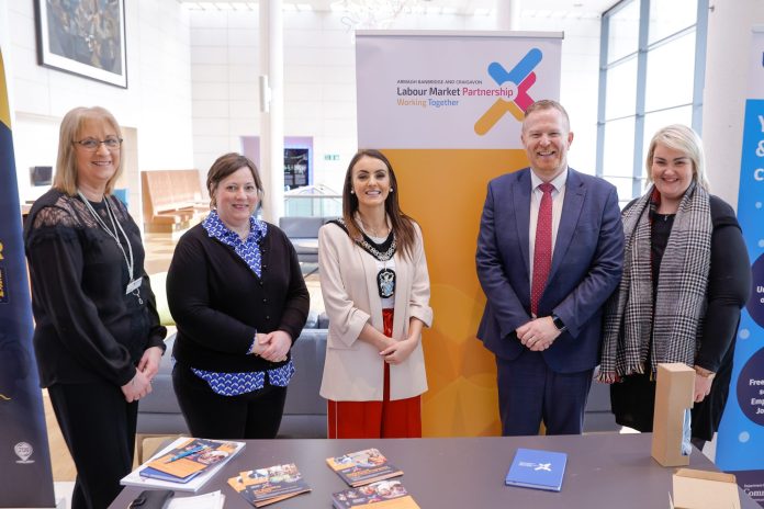 People standing together at a job fair in The Market Place Theatre Armagh.